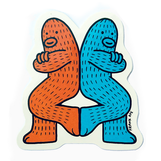Sticker with two cartoon sasquatch characters, one orange and one blue, Back to back on a white background. Friendship