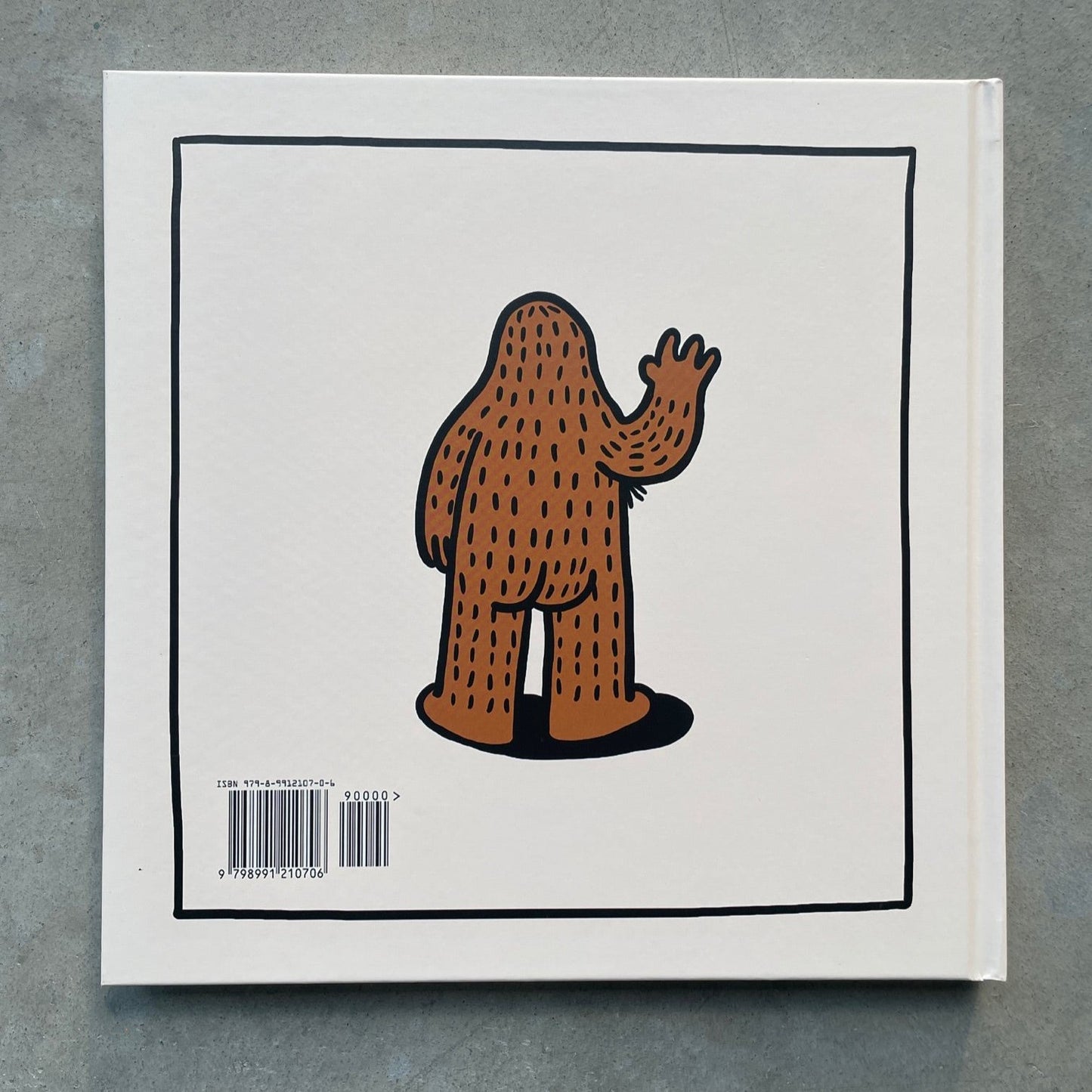 Hardcover book titled 'There's Magic Inside All of Us' with a colorful illustration of the back side of Frank Ape, a magical sasquatch on the back cover.